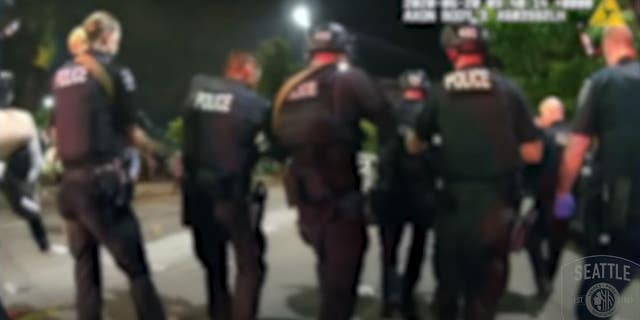 Seattle police said officers had trouble reaching the scene of the shooting because they were met by a "violent crowd."