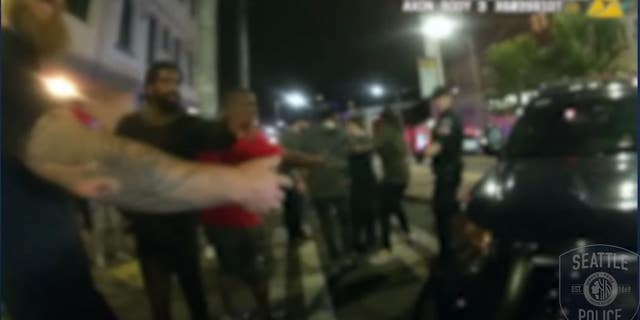 Several protesters can be seen in the video forming a human chain to prevent other protesters from following officers during their retreat.