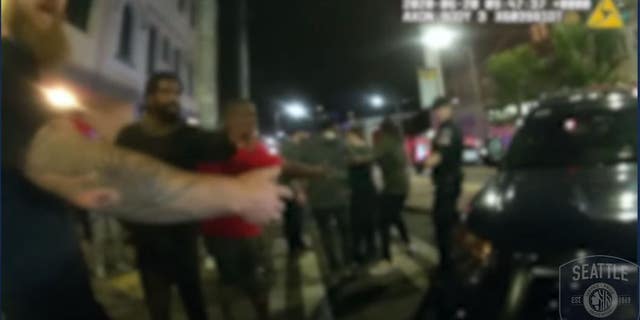 Several protesters can be seen in the video forming a human chain to prevent other protesters from following officers during their retreat.