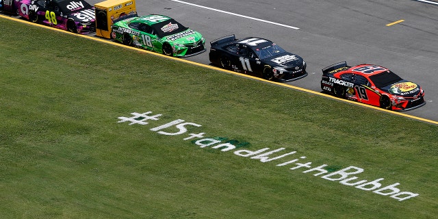 NASCAR added a #ISTandWithBubba message on the infield grass at Talladega Speedway
