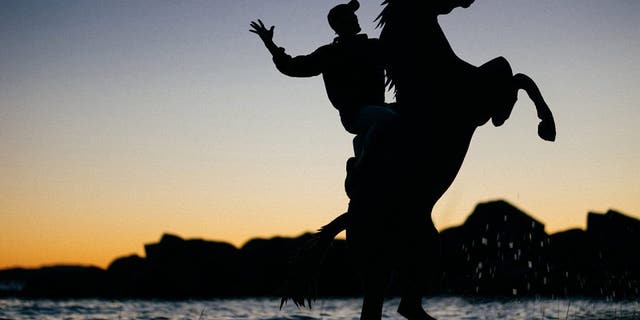 John Marshall rides a horse in a fun selfie created using cardboard in Maine. (Credit: SWNS)