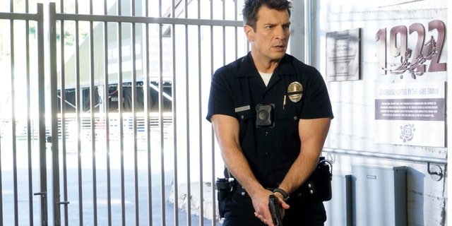 Series star Nathan Fillion was reportedly on the scene of 'The Rookie' cop drama when production was interrupted by gunfire near its filming location on Thursday in Los Angeles, Calif.