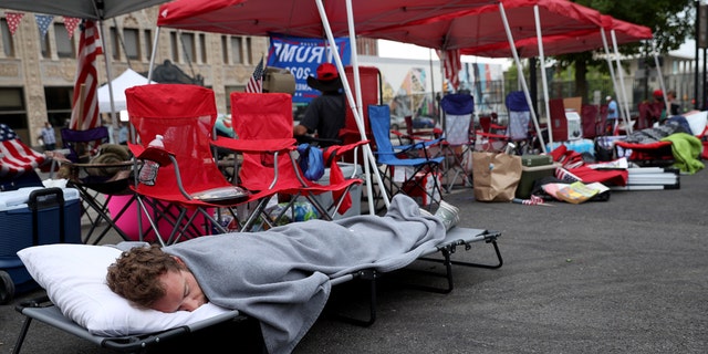 June 19: Supporters of President Trump sleep in the early morning while lined up to attend the Trump campaign rally near the BOK Center, in Tulsa, Oklahoma. (Photo by Win McNamee/Getty Images)