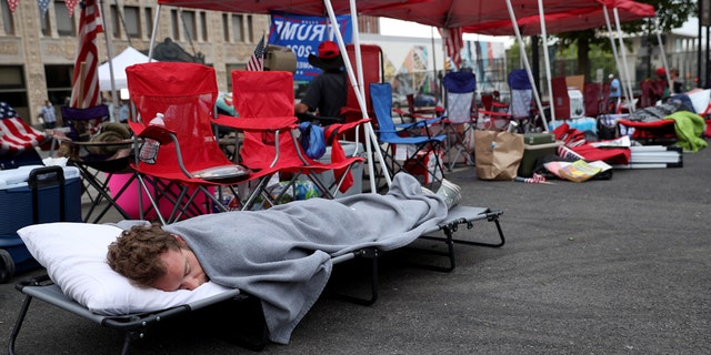 June 19: Supporters of President Trump sleep in the early morning while lined up to attend the Trump campaign rally near the BOK Center, in Tulsa, Oklahoma. (Photo by Win McNamee/Getty Images)