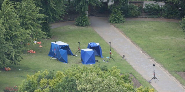 An aerial view showing blue police tents Sunday in Forbury Gardens, the scene of a stabbing attack in Reading on Saturday. (Jonathan Brady/PA via AP)