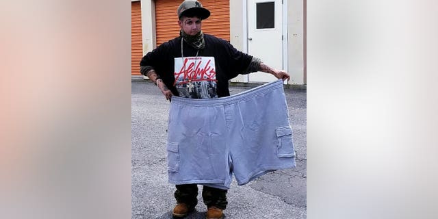 Jen Costa with the shorts she wore prior to her dramatic weight loss. (SWNS)