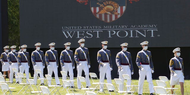 United States Military Academy graduating cadets wearing face masks march to their socially-distanced seating during commencement ceremonies, Saturday, June 13, 2020, in West Point, N.Y. (AP Photo/John Minchillo, Pool)