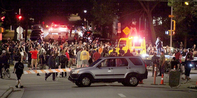 Protesters block traffic at an intersection an intersection near Capitol Square in Madison on Tuesday. (Emily Hamer/Wisconsin State Journal via AP)