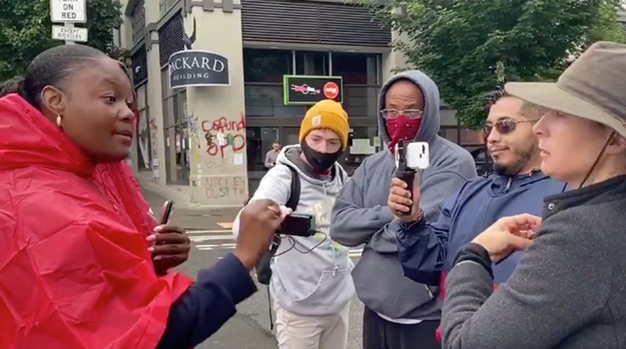 Street preacher tells Seattle protester 