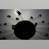 A visitor enjoys the swing ride at the Yomiuriland amusement park in Tokyo, June 16, 2020.?