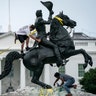 Protesters attempt to pull down the statue of Andrew Jackson in Lafayette Square near the White House in Washington, June 22, 2020. 