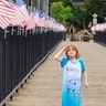 Walking over a bridge after a family trip to the lake, in Folsom, Calif. Our daughter Abigail had to stop and get a picture showing how she feels about America. We are a couple of proud parents!