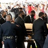 Texas Southern University police saluting as family and guests arrived for George Floyd's funeral service.