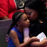 Roxie Washington holding Gianna Floyd, the daughter of George Floyd, as they attended the funeral service.