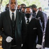 Pallbearers bringing the coffin into The Fountain of Praise church in Houston.