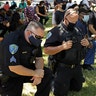 Police officers kneeling during the "Taking a Knee for Justice and Prayer" service on June 3 in Fairfield, Calif.