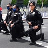 Los Angeles Police Department officers kneeling during a rally led by Baptist Ministers to City Hall on June 2. 