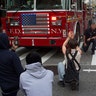 Protesters kneeling with a fireman on June 2 in New York City. 