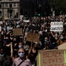 London, England: People march through Parliament Square in central London on Sunday, May 31, 2020.