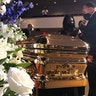 Martin Luther King III taking a moment by George Floyd's casket.