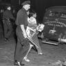Police leading women to patrol cars in the Harlem area of New York, on Aug. 2, 1943, during clashes with police following the shooting of a policeman and six civilians. The unrest was sparked by the shooting of Robert Bandy, a black soldier, by a white policeman. 