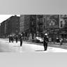 New York police officers wearing steel helmets and carrying nightsticks as they patrolled a street in the Harlem neighborhood of New York to prevent further rioting, Aug. 2, 1943. 