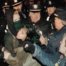 New York City police grappling with anti-war protesters outside a hotel on Feb. 6, 1991, where then-President George H.W. Bush was addressing the Economic Club of New York.