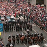 New York City police, including mounted officers, facing a crowd of union protesters on Fifth Avenue June 30, 1998, in New York. A large, noisy demonstration by thousands of construction workers tied up Midtown Manhattan and disrupted business during the morning rush.