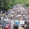 People holding up signs during a demonstration calling for justice for the death of George Floyd, in Montreal, Canada. 