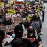 People marching to protest during a solidarity rally in Seoul, South Korea.