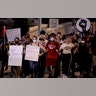 Demonstrators march up Main Street in Kansas City, Mo., during a protest over the death of George Floyd, on June 4, 2020.