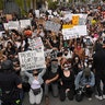 Demonstrators kneeling in front of the police in Los Angeles. 