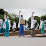 Health care professionals gather outside Barnes-Jewish Hospital to demonstrate in support of the Black Lives Matter movement, June 5, 2020, in St. Louis, Mo.