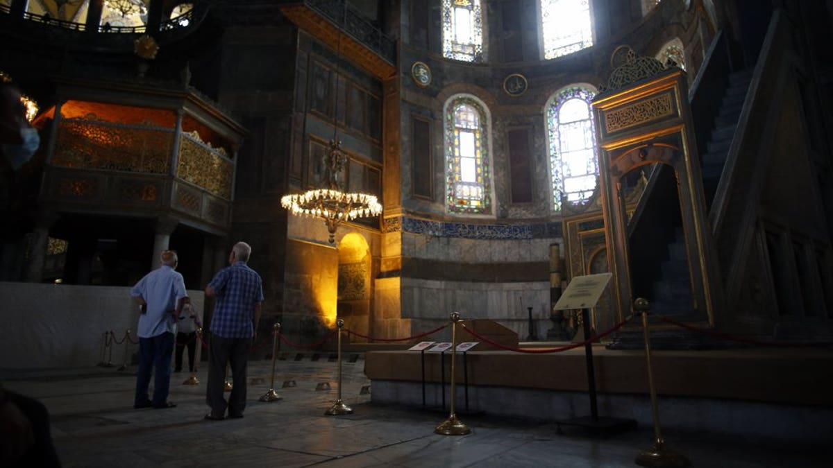 People visit the Byzantine-era Hagia Sophia, an UNESCO World Heritage site and one of Istanbul's main tourist attractions in the historic Sultanahmet district of Istanbul, Friday, July 10, 2020.