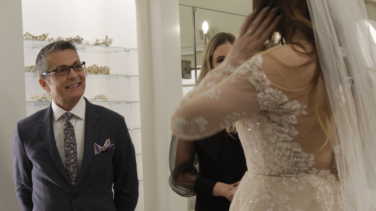 Randy Fenoli (L) with a bride.