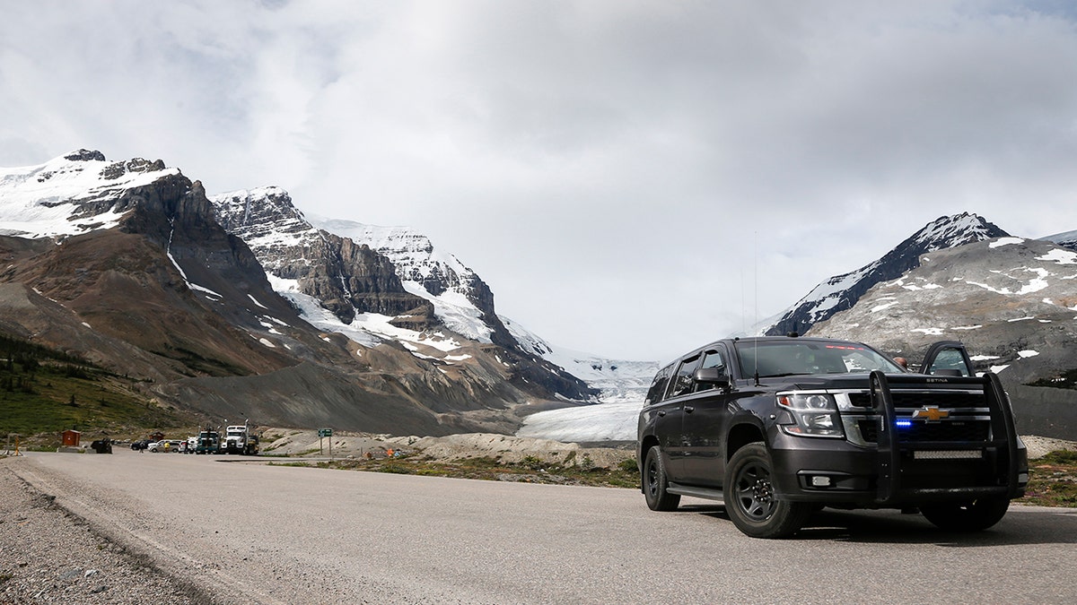 Royal Canadian Mounted Police attend the scene of a sightseeing bus rollover at the Columbia Icefields near Jasper, Alta., Sunday, July 19, 2020.