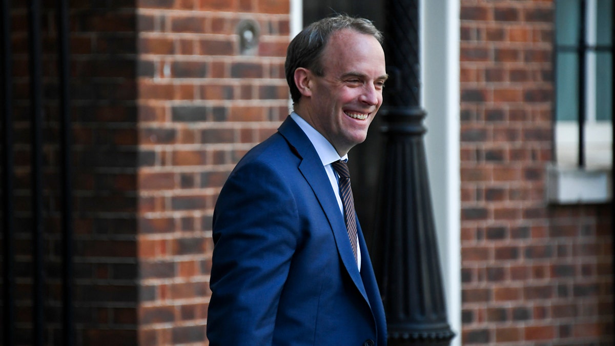 FILE - In this file photo dated Thursday, May 7, 2020, Britain's Foreign Secretary Dominic Raab arrives at 10 Downing Street, in London. Raab on Monday July 6, 2020, announced targeted economic sanctions against individuals and organizations from Russia, Saudi Arabia, Myanmar and North Korea under new U.K. powers to punish human-rights offenders.(AP Photo/Alberto Pezzali, FILE)