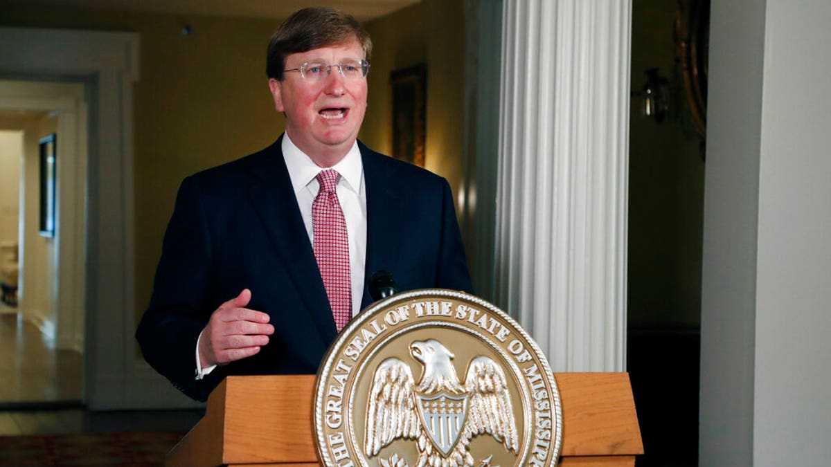 FILE: Mississippi Gov. Tate Reeves delivers a televised address prior to signing a bill retiring the last state flag in the United States with the Confederate battle emblem, during a ceremony at the Governor's Mansion in Jackson, Miss. 