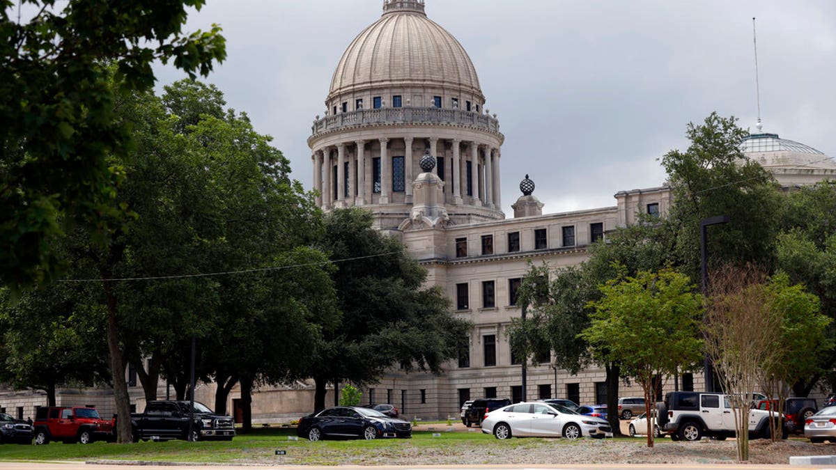 FILE: Mississippi legislators, staff and Capitol employees take advantage of a drive-thru COVID-19 testing center on the Capitol grounds in Jackson, Miss. 