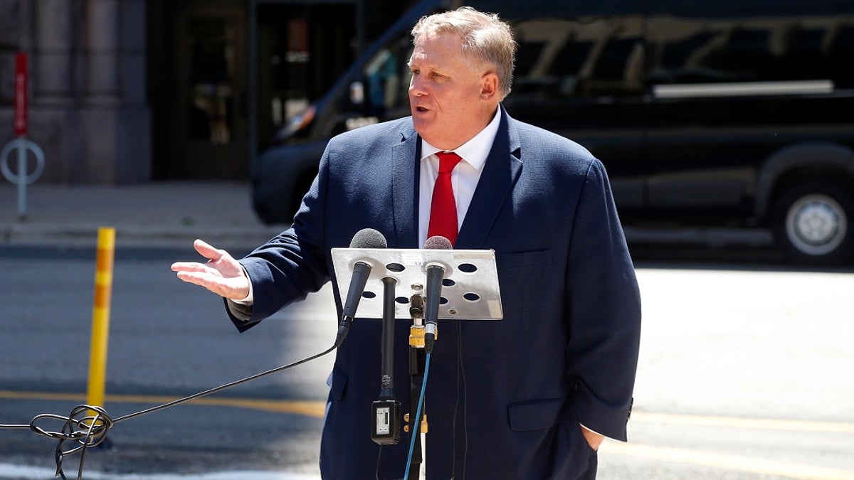 Attorney Ron Meuser, Jr. addresses a news conference across from Minneapolis City Hall on Friday where he discussed the alarming rate of Minneapolis Police Officers who are filing claims for Post-Traumatic Stress Disorder (PTSD). He said In the last six weeks, over 150 police officers have started the process of filing physical and mental disability claims, the majority of which encompass officers suffering from PTSD. (AP Photo/Jim Mone)