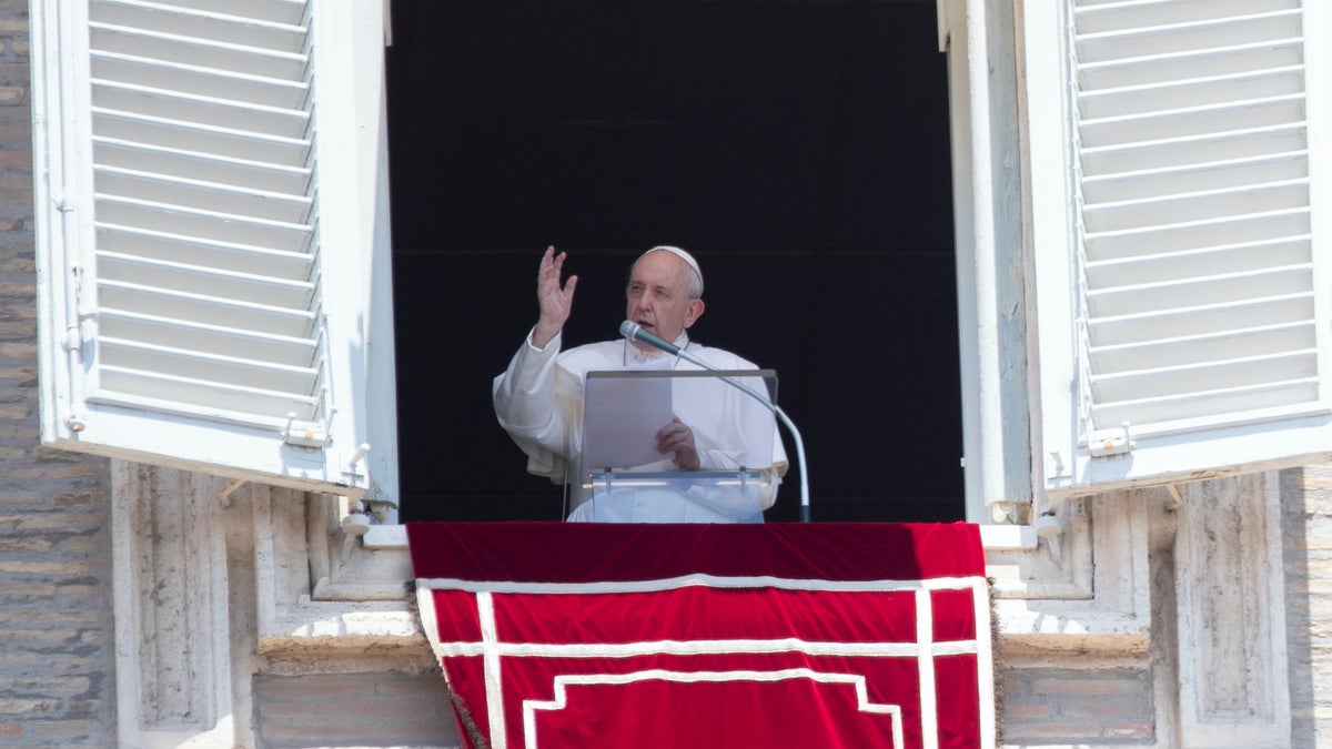 Pope Francis delivers his blessing to faithful during the Angelus prayer from the window of his studio overlooking St. Peter's Square at the Vatican, Sunday, July 12, 2020. (AP Photo/Alessandra Tarantino)