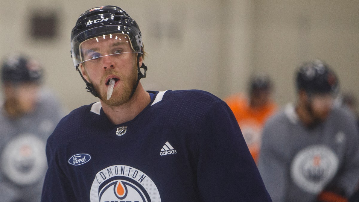 Edmonton Oilers' Connor McDavid (97) takes part in NHL hockey training camp in Edmonton, Alta., on Tuesday July 14, 2020. (Jason Franson/The Canadian Press via AP)