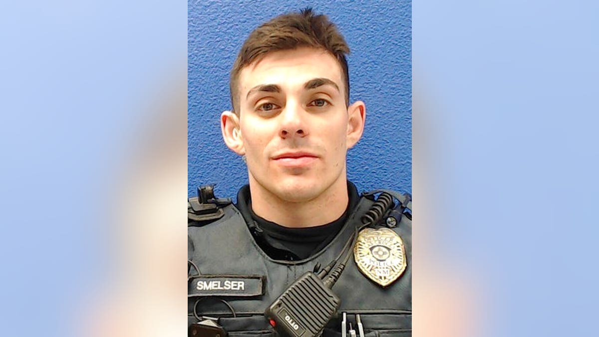This undated photo provided by the Las Cruces Police Department shows former officer Christopher Smelser, who has been charged with second-degree murder after authorities say he killed a detainee he had placed in a chokehold. (Las Cruces Police Department via AP)