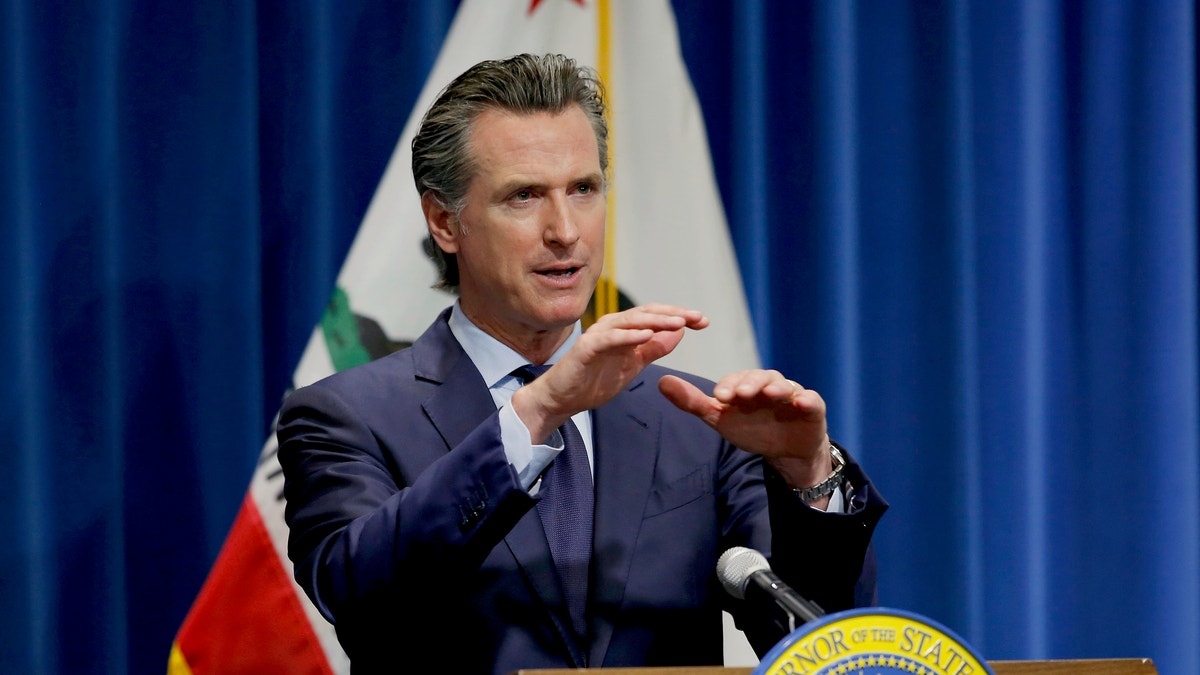 In this May 14, 2020, file photo, California Gov. Gavin Newsom discusses his revised 2020-2021 state budget during a news conference in Sacramento, Calif. Gov. Gavin Newsom announced Friday, July 17, 2020, that most counties will start the school year online due to soaring coronavirus cases and hospitalizations, but counties that have seen little of the virus, mostly towns and rural communities in California's north and east can bring students and teachers back to campus. (AP Photo/Rich Pedroncelli, Pool, File)