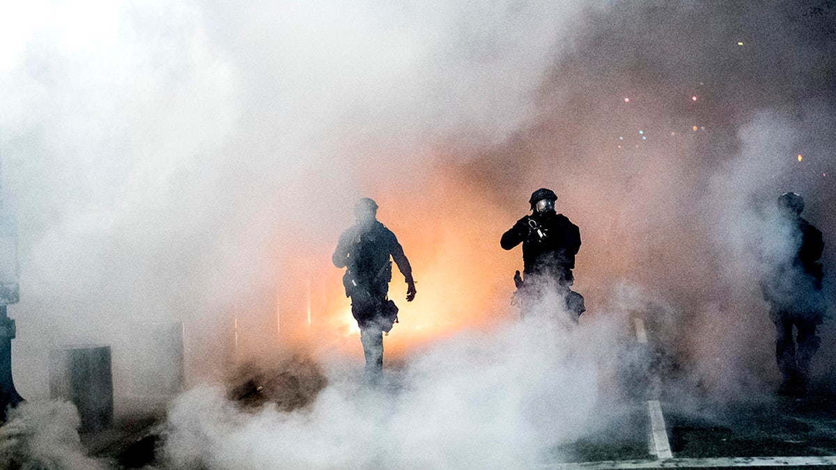 Federal officers use crowd control munitions to disperse Black Lives Matter demonstrators outside the Mark O. Hatfield United States Courthouse on Tuesday, July 21, 2020, in Portland, Ore.