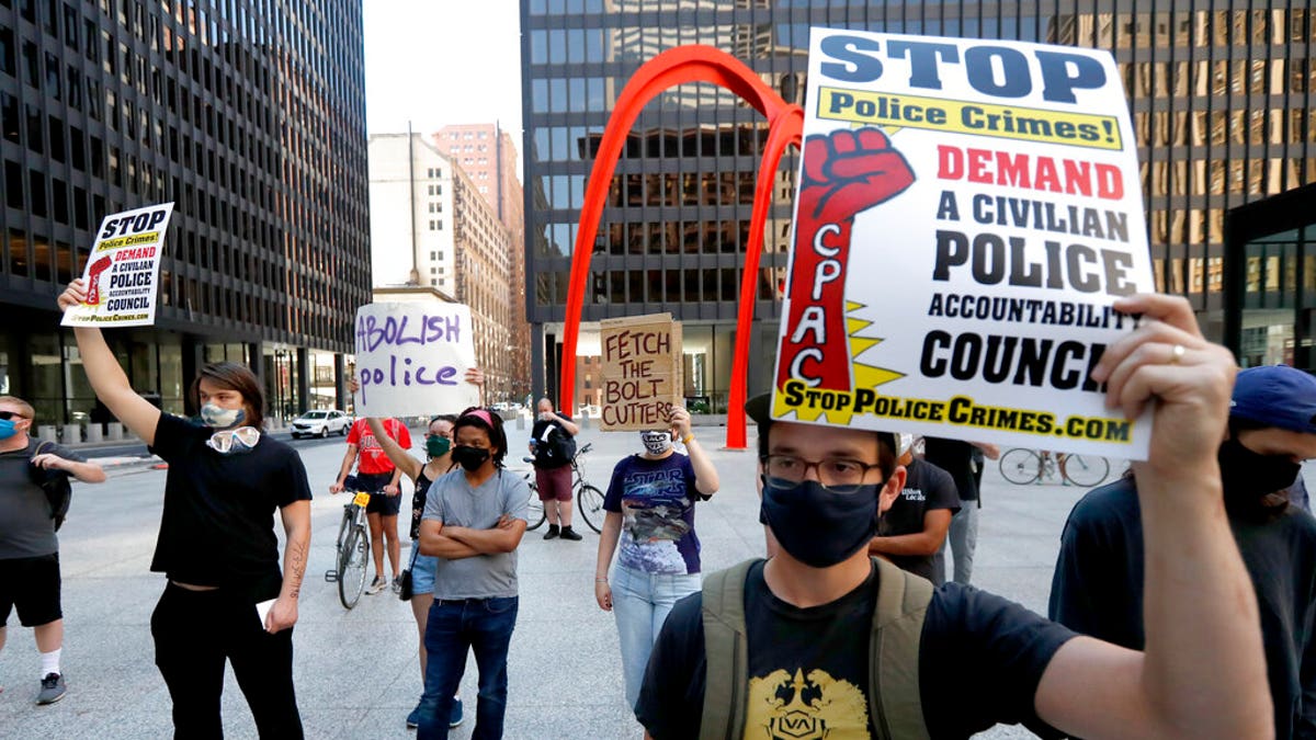 Protesters gather on Federal Plaza after a collection of Chicago activists groups announced they are filing a federal lawsuit against the Chicago Police Department, Fraternal Order of Police, and the federal government, in Chicago. 