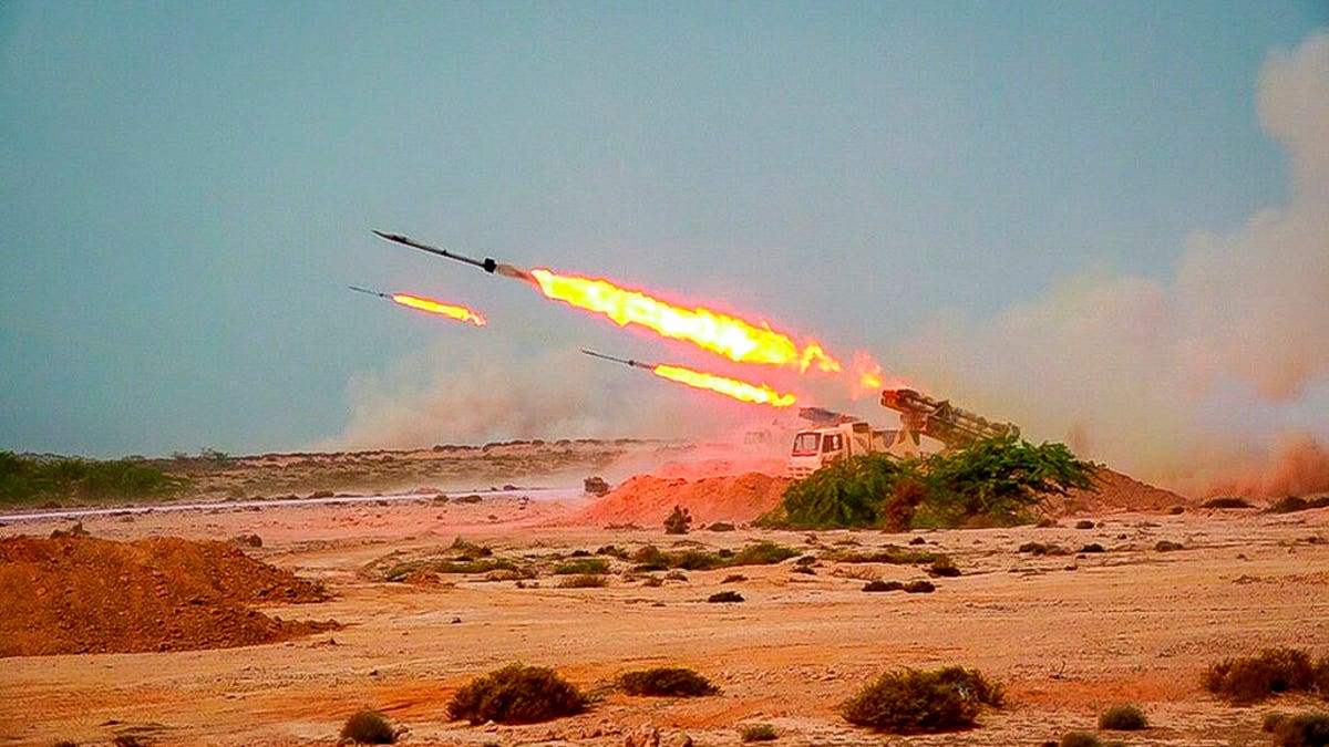 Missiles are fired in a Revolutionary Guard military exercise. Iran's paramilitary Revolutionary Guard fired a missile from a helicopter targeting the mock-up aircraft carrier in the strategic Strait of Hormuz. (Sepahnews via AP)
