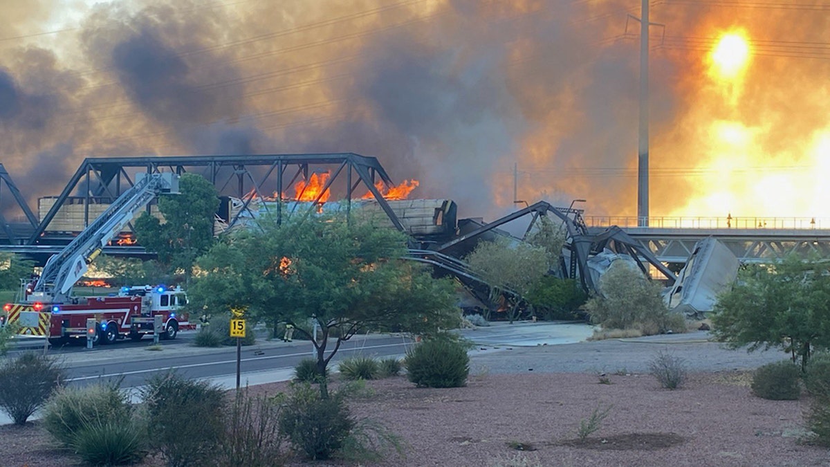 A train bridge partially collapsed after a derailment and fire in Tempe, Ariz. on July 29, 2020.