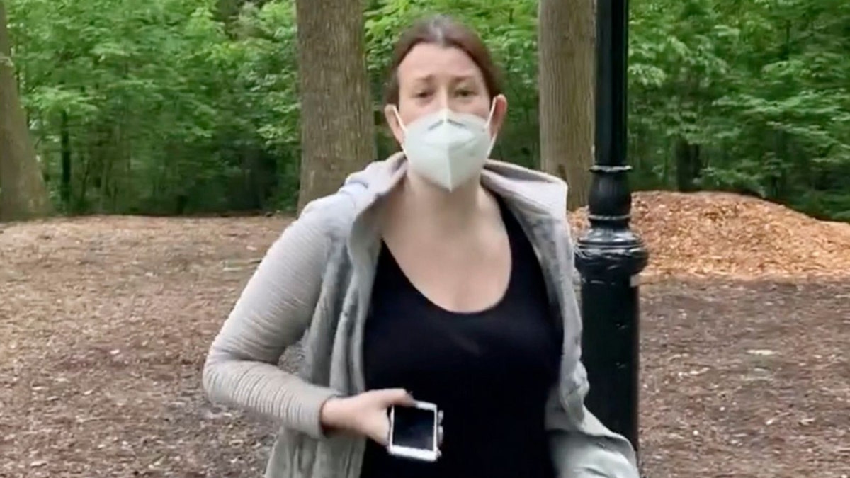 This file image made from May 25, 2020 video provided by Christian Cooper, shows Amy Cooper with her dog talking to Christian Cooper in Central Park in New York. Amy Cooper, walking her dog who called the police during a videotaped dispute with Christian Cooper, a Black man, was charged Monday, July 6, 2020, with filing a false report.