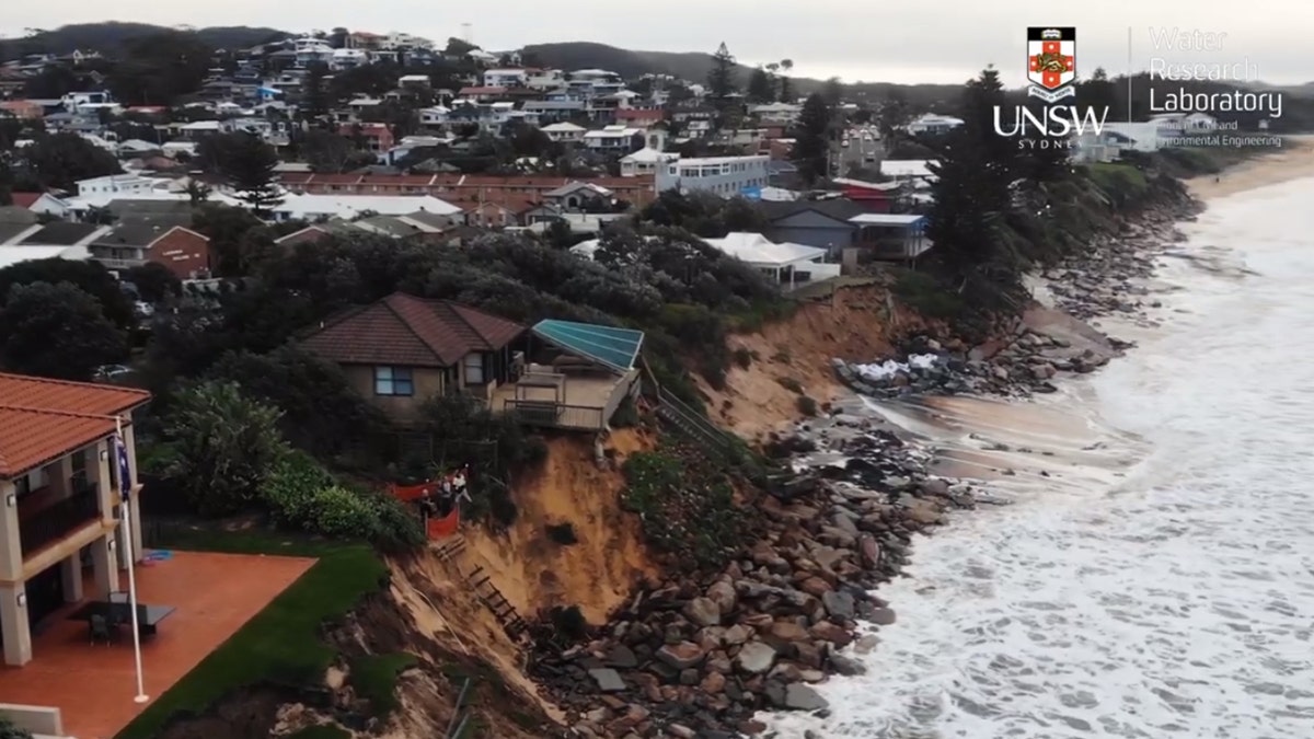 The eroded shoreline and damage to property along the coast in Wamberal, Australia can be seen in this drone footage.